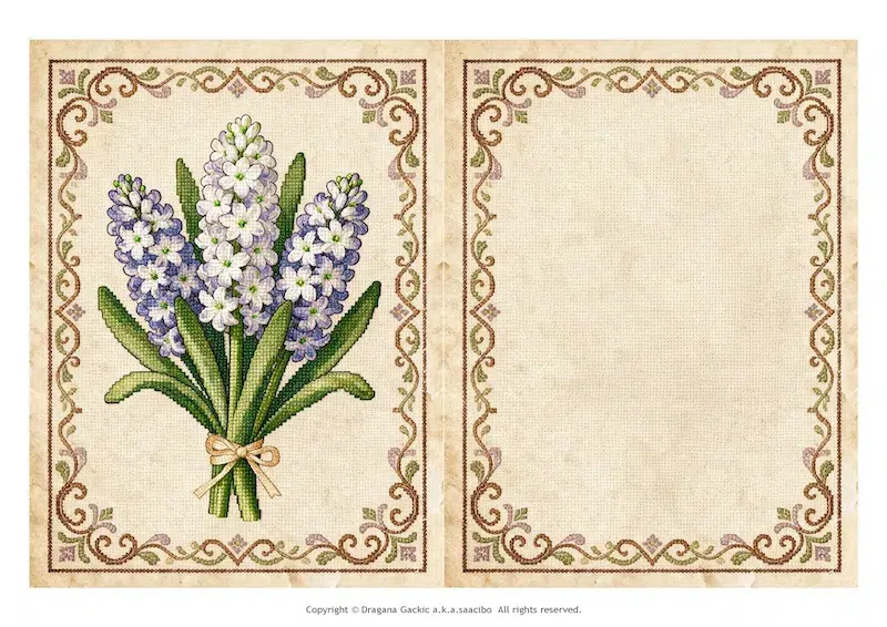 Faux cross stitch card with a white and lilac hyacinth bouquet in a brown lace frame